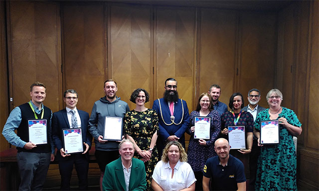 Cohort of teachers at Luton Town Hall with Mayor Yaqub Hanif celebrating graduating from the scheme.
