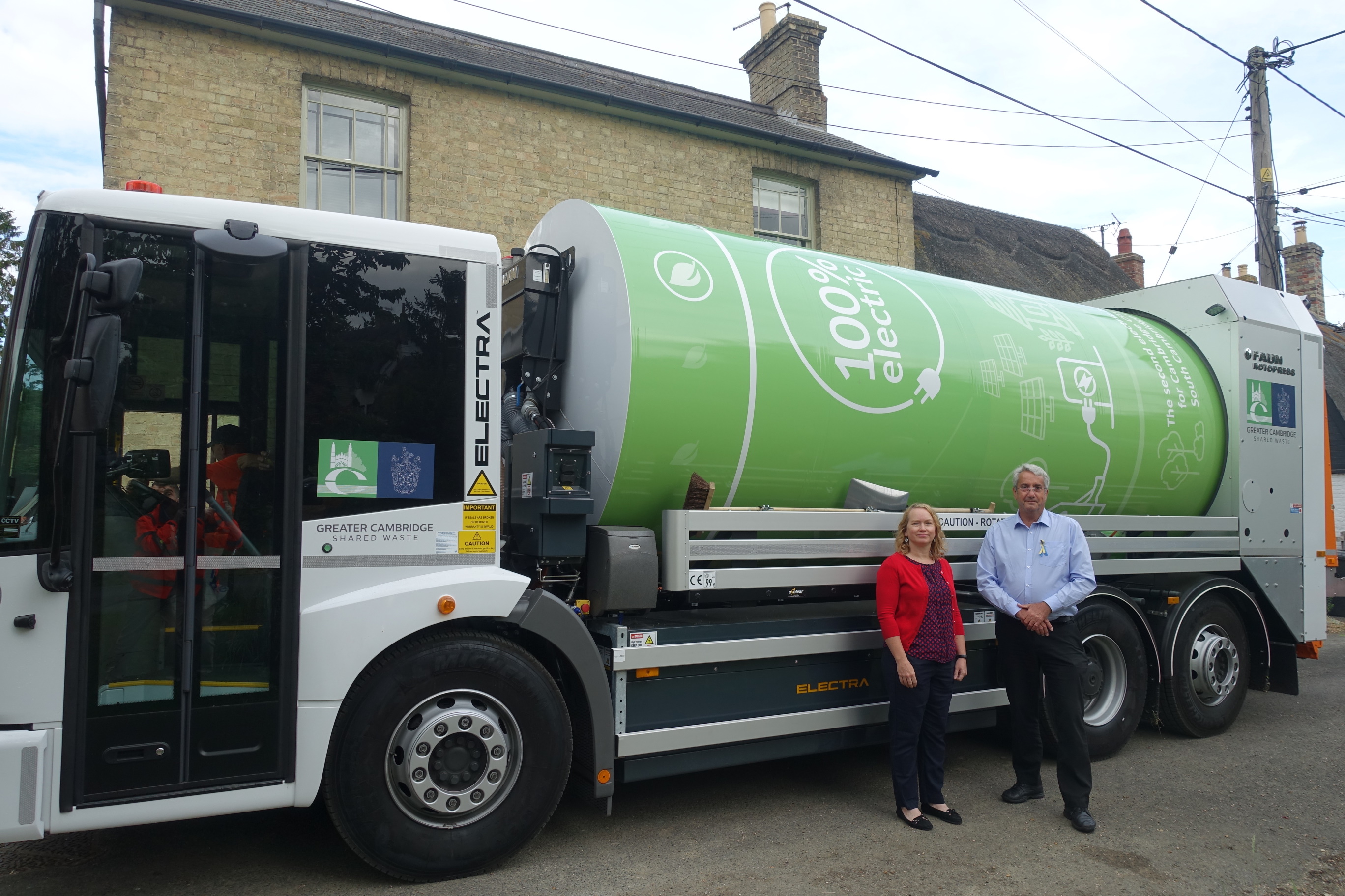 Cllr Brian Milnes and Cllr Rosy Moore with Greater Cambridge Shared Waste in front of a fully electric bin lorry