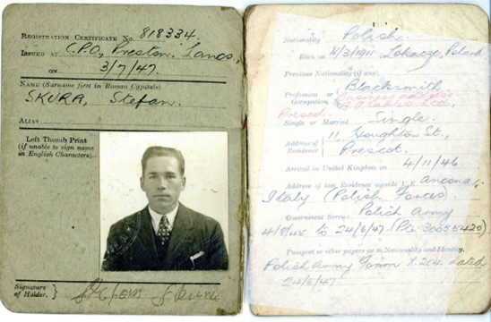 An identification photograph of a white man in a suit and tie, in an ID document