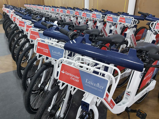 A row of Santander bikes on a rack