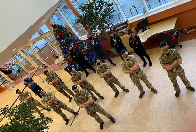 Wirral Military Personnel posing by a christmas tree with face masks on