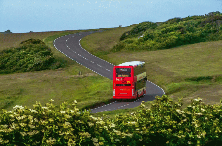 Solitary bus going down a country road