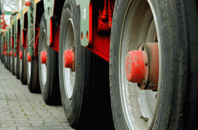 Photo of red and grey lorry wheels