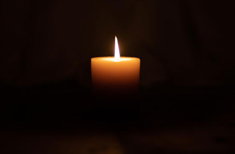 Candle shining in the dark