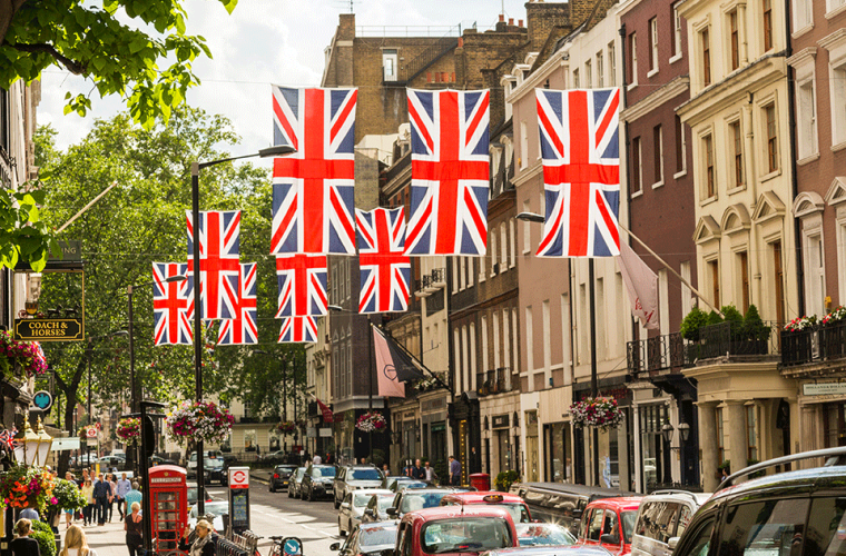 Road with many British flags hanging from buildings