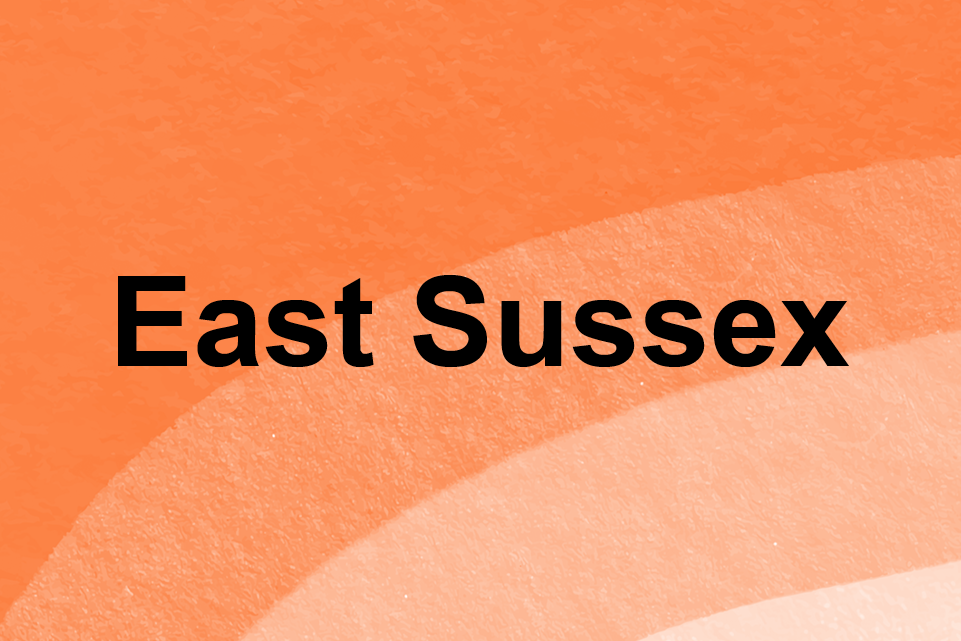 Orange background with text: East Sussex